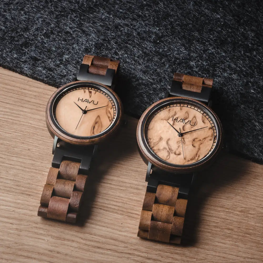Two havu aava 38mm wooden watches with natural wood grain faces and dark brown interlocking wooden bands