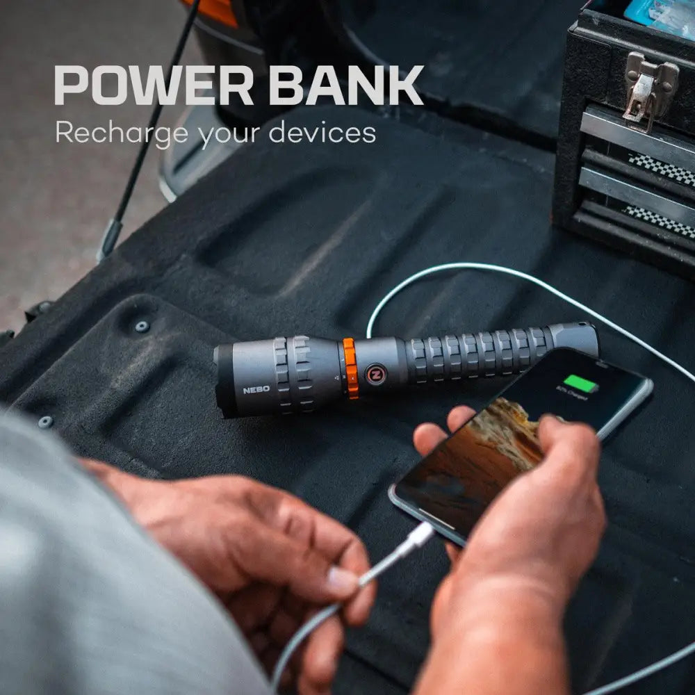 Black and orange nebo power bank davinci 8000 with textured grip design for secure handling