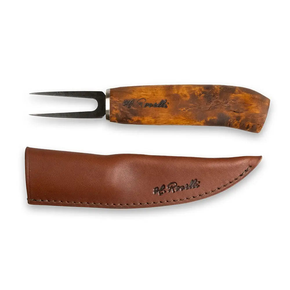 Fish fork with polished black metal prongs and amber brown wooden handle alongside matching brown leather sheath