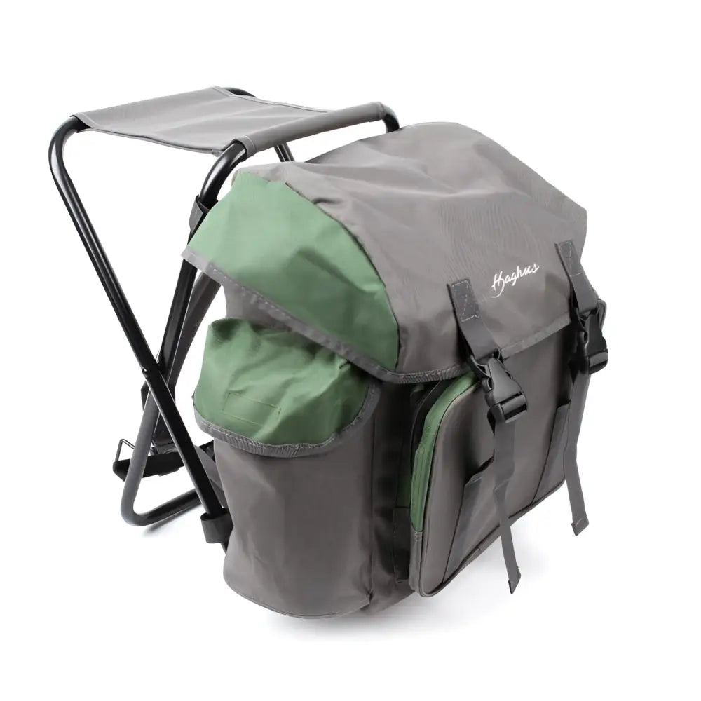 Gray and green foldable camping stool with built-in backpack design black metal frame and adjustable straps in haghus stol bag reppujakkara 35l