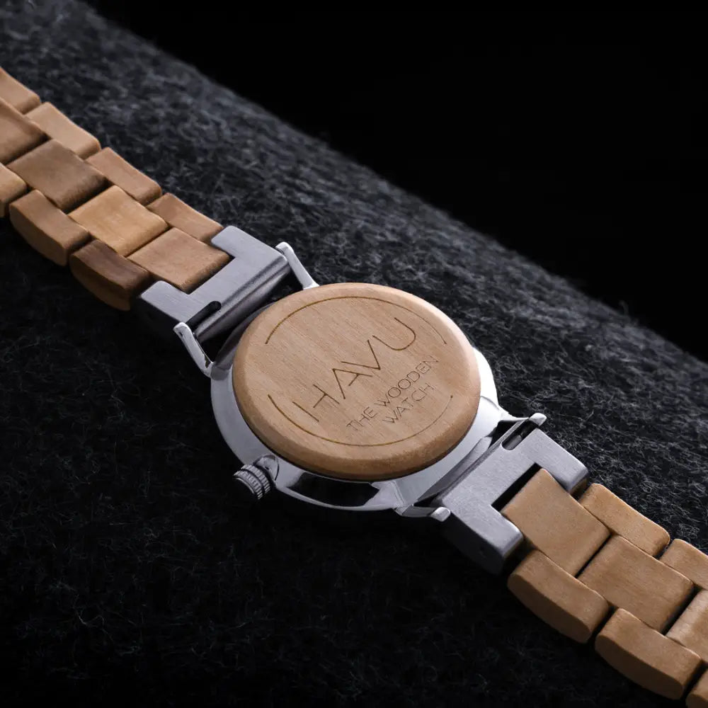 A sleek wooden watch havu watches kielo 32mm with light brown natural wood band and silver metal clasp