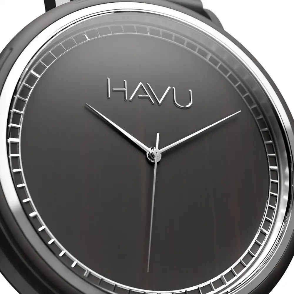A sleek black Havu Watches Virta 38mm puinen rannekello with minimalist dial and silver-toned hands and markers