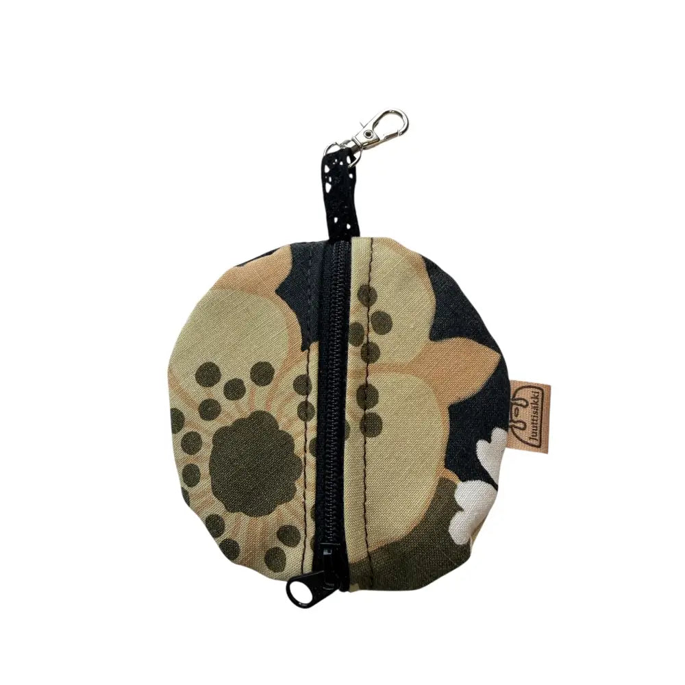 Kuulokepussi pyöreä kolikkopussi oliivinvihreä ja beige kukkakuvio mustalla vetoketjulla ja hopeanvärisellä avaimenperällä