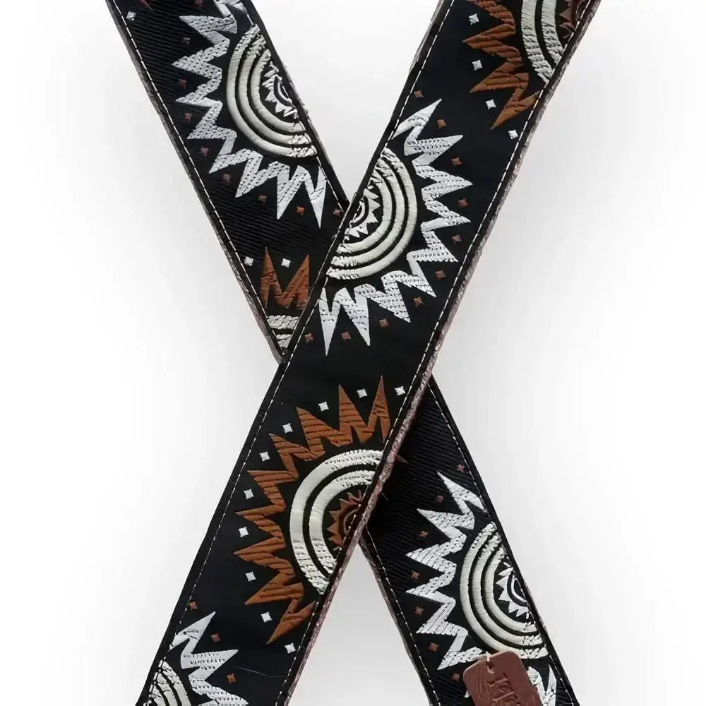 Black leather crossbody strap with intricate white and brown embroidered sunburst patterns for laukkun olkahihna retro