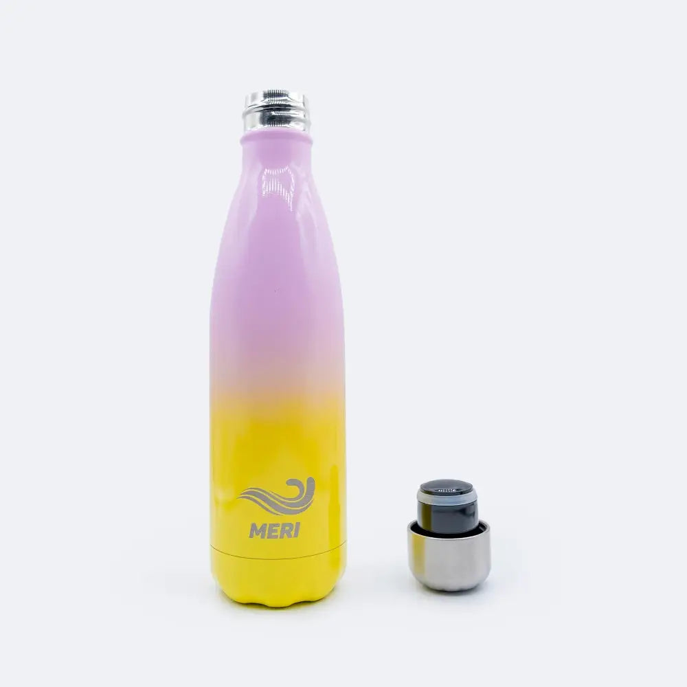 A sleek gradient pink to yellow stainless steel meribottles bubblegum 500 ml water bottle with silver cap and meri logo