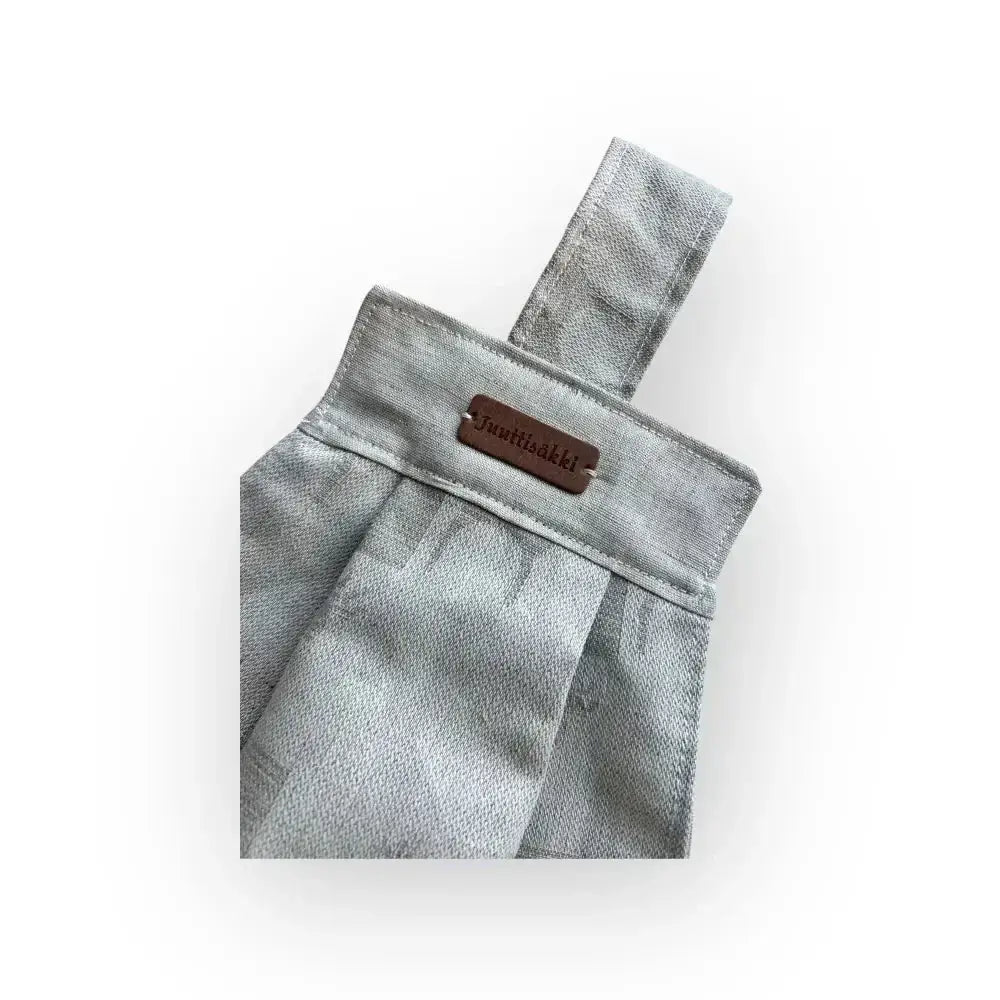 Gray linen-style fabric pouch with brown leather jumiaakki tag for näppipyyhe hirvi product
