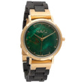 A sleek havu watch revontuli eebenpuu 32mm with a vibrant green malachite dial gold-tone hands casing and black silicone strap