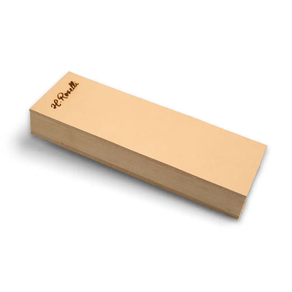 A light tan rectangular whetstone with a smooth polished surface from roselli nahkahihna product line